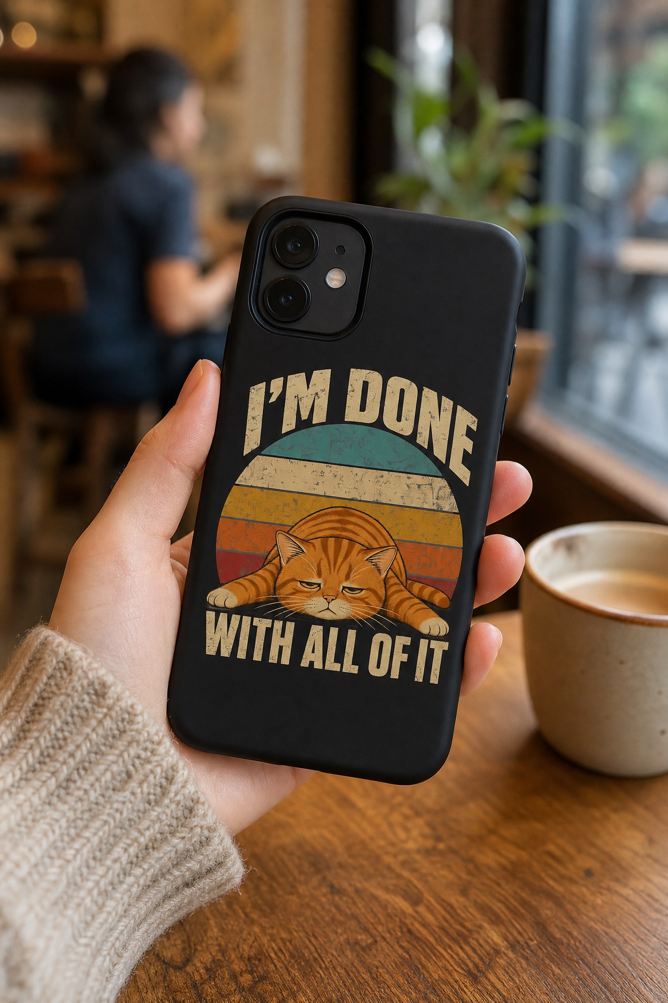 Person wearing a Cranky Kitten phone case