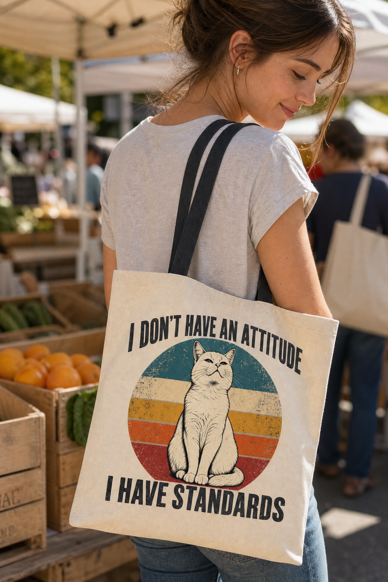 Person wearing a Cranky Kitten tote bag